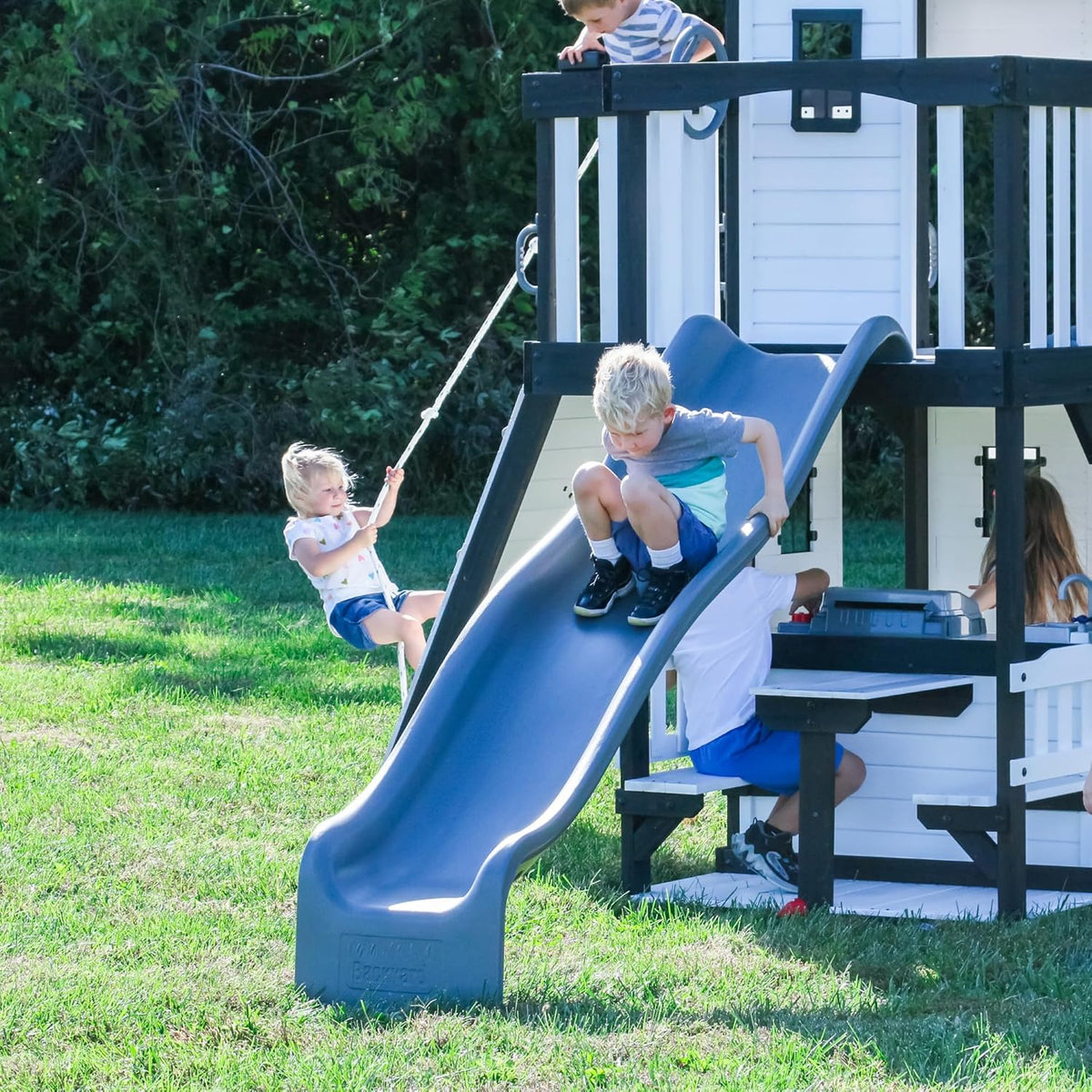 Backyard Discovery Canyon Creek Cedar Wood Swing Set with Wave Slide, Clubhouse, Play Kitchen, Picnic Area, Belt Swings, Web 
